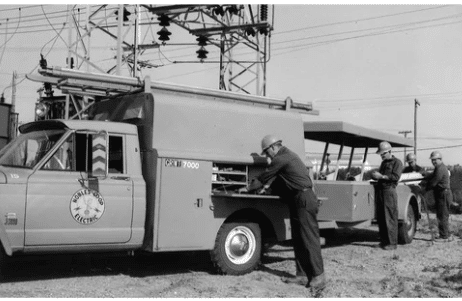 linemen nobles cooperative electric linmen don pearson, bud harsma, art torgeson, and ben hanson getting their equipment ready for the day in july 1969.