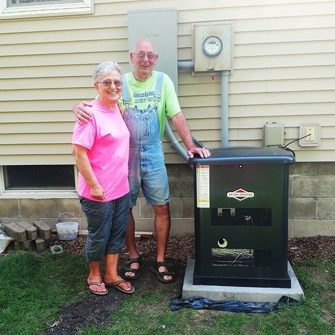 Standby Generator Elderly Couple Standing by a Generator